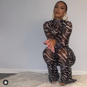 NAKED WARDROBE Long Sleeve Animal Print Mesh Jumpsuit In Bl/wh Zebra